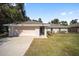 Cute one-story home with attached garage and well-manicured lawn at 14185 Sw 30Th Pl, Ocala, FL 34481