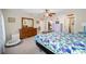 Main bedroom with ceiling fan, large closet, and neutral carpeting at 14185 Sw 30Th Pl, Ocala, FL 34481