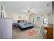 Spacious bedroom with ceiling fan, ample closet space, and carpeted floors at 14185 Sw 30Th Pl, Ocala, FL 34481