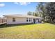 Spacious backyard with patio and grassy area at 14185 Sw 30Th Pl, Ocala, FL 34481