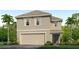 Two story house with attached garage and landscaping at 8449 Las Palmas Way, Wildwood, FL 34785