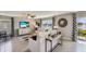 Bright and airy living area with lake view and comfortable furnishings at 8449 Las Palmas Way, Wildwood, FL 34785