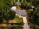 Single story house with attached garage, large yard, and surrounding trees at 12805 Sw 64Th Ln, Ocala, FL 34481