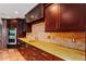 Bright kitchen with granite countertops and dark wood cabinetry at 34241 S Haines Creek Rd, Leesburg, FL 34788