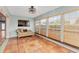 Sunroom with terracotta tile floors and built-in seating at 34241 S Haines Creek Rd, Leesburg, FL 34788