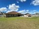 Large backyard with spacious lawn, gazebo, and patio at 10923 Sw 38Th Ave, Ocala, FL 34476