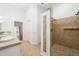 Bathroom with walk-in shower and double vanity at 6042 Topsail Rd, Lady Lake, FL 32159