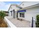 Front entrance with a blue door and a covered porch at 6042 Topsail Rd, Lady Lake, FL 32159