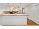 Modern kitchen features stainless steel appliances and light wood flooring at 6042 Topsail Rd, Lady Lake, FL 32159