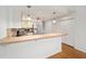 Modern kitchen features stainless steel appliances and light wood flooring at 6042 Topsail Rd, Lady Lake, FL 32159