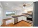 Modern kitchen with stainless steel appliances and breakfast bar at 6042 Topsail Rd, Lady Lake, FL 32159