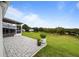 Spacious patio with pavers, overlooking a scenic landscape at 6042 Topsail Rd, Lady Lake, FL 32159