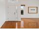 Spacious living room featuring hardwood floors and large windows at 6042 Topsail Rd, Lady Lake, FL 32159