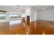 Spacious living room featuring hardwood floors and large windows at 6042 Topsail Rd, Lady Lake, FL 32159