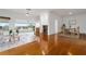 Bright living room with hardwood floors, fireplace, and view at 6042 Topsail Rd, Lady Lake, FL 32159