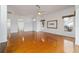 Sunlit living room, hardwood floors, and ceiling fan at 6042 Topsail Rd, Lady Lake, FL 32159