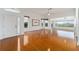 Open living room with hardwood floors and view at 6042 Topsail Rd, Lady Lake, FL 32159