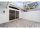 Private paved patio with covered lanai at 6042 Topsail Rd, Lady Lake, FL 32159