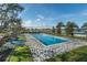 Community lap pool with surrounding lounge chairs at 4111 Nw 48Th Terrace Rd, Ocala, FL 34482