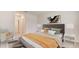 Main bedroom with a plush bed, nightstands, and an ensuite bathroom at 9965 Se 161St Lane Rd, Summerfield, FL 34491