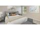 Cozy bedroom with a queen-sized bed, and neutral-toned bedding at 9965 Se 161St Lane Rd, Summerfield, FL 34491