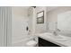 Bathroom with a tub, toilet and vanity with a granite countertop at 9965 Se 161St Lane Rd, Summerfield, FL 34491
