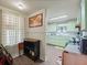 Eat-in kitchen with light green cabinets and laminate flooring at 712 Sw 10Th Ave, Ocala, FL 34471