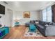 Spacious living room showcasing hardwood floors and a sectional sofa at 712 Sw 10Th Ave, Ocala, FL 34471