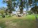 Spacious backyard with a covered patio area at 712 Sw 10Th Ave, Ocala, FL 34471
