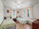 Two twin beds in a bedroom with hardwood floors and natural light at 712 Sw 10Th Ave, Ocala, FL 34471