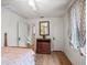 Bedroom with hardwood floors, ceiling fan, and dresser at 712 Sw 10Th Ave, Ocala, FL 34471