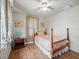 Bedroom with a queen bed, hardwood floors, and ceiling fan at 712 Sw 10Th Ave, Ocala, FL 34471