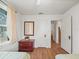 Bedroom with hardwood floors, ceiling fan, and access to hallway at 712 Sw 10Th Ave, Ocala, FL 34471