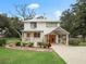 Charming two-story house with a carport and well-manicured lawn at 712 Sw 10Th Ave, Ocala, FL 34471