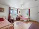 Two twin beds in a bedroom with hardwood floors and large windows at 712 Sw 10Th Ave, Ocala, FL 34471