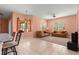 Comfortable living room with neutral colored couch and access to the kitchen and dining area at 8386 Sw 82Nd Cir, Ocala, FL 34481