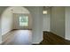 Bright dining room with hardwood floors and arched entryway at 4503 Sw 132Nd St, Ocala, FL 34473
