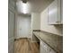 Laundry room with granite countertop and built-in cabinets at 4503 Sw 132Nd St, Ocala, FL 34473