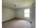 Well-lit bedroom featuring neutral walls and carpeted floors at 4503 Sw 132Nd St, Ocala, FL 34473