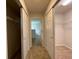 Hallway with two large walk-in closets and additional storage at 4503 Sw 132Nd St, Ocala, FL 34473