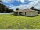 Large backyard with grassy area behind the house at 4503 Sw 132Nd St, Ocala, FL 34473