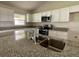 Modern kitchen featuring granite countertops and stainless steel appliances at 4503 Sw 132Nd St, Ocala, FL 34473