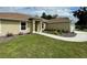 Tan house with walkway leading to the front entrance at 4503 Sw 132Nd St, Ocala, FL 34473