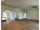 Open living room with hardwood floors and access to kitchen at 4503 Sw 132Nd St, Ocala, FL 34473