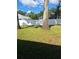 Landscaped backyard with tall trees and privacy fence at 10970 Sw 69Th Cir, Ocala, FL 34476