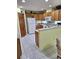Kitchen with oak cabinets, white appliances, and a breakfast bar at 10970 Sw 69Th Cir, Ocala, FL 34476