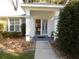 Front entrance with double doors and covered porch at 10970 Sw 69Th Cir, Ocala, FL 34476