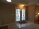 Bright entryway with double doors leading to the interior at 10970 Sw 69Th Cir, Ocala, FL 34476