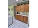 Kitchen boasts ample cabinet space and a large countertop area at 10970 Sw 69Th Cir, Ocala, FL 34476