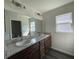 Bathroom with a double vanity and granite countertop at 2030 Sw 163Rd Pl, Ocala, FL 34473